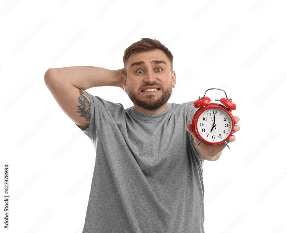 Emotional overslept man with alarm clock on white background. Being late concept Emotional overslept man with alarm clock on white background. Being late concept