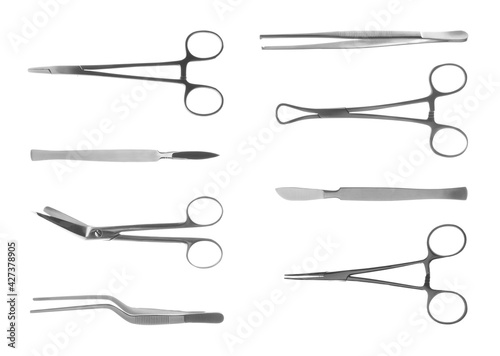 Set with different surgical instruments on white background