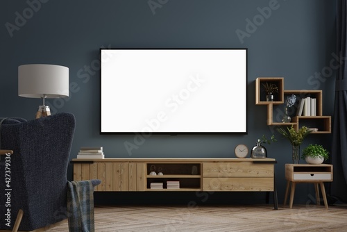 Mockup tv on cabinet in modern empty room at night with behind the dark blue wall.