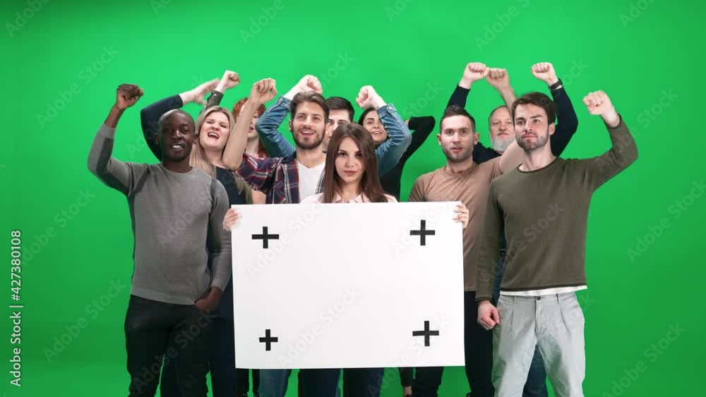 Protest movement, female activist holding a protest poster, a protesting crowd in the background, people shouting and sconding, template on a chromakey, 4k slow motion,
