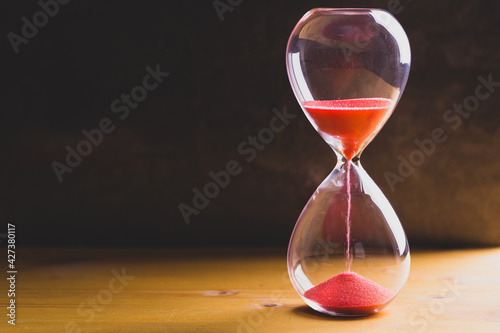 Sand glass, modern hourglass showing last second or last minute or time out. With copy space.