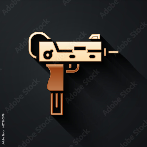 Gold UZI submachine gun icon isolated on black background. Automatic weapon. Long shadow style. Vector