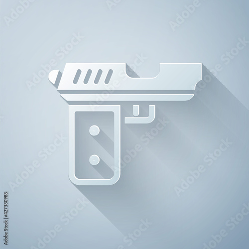 Paper cut Pistol or gun icon isolated on grey background. Police or military handgun. Small firearm. Paper art style. Vector