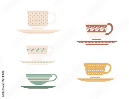 Colored set of ceramic tea cup on saucers with different patterns vector illustration isolated on white background