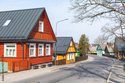  Old Lithuanian traditional green wooden houses with three windows in Trakai, Vilnius, Lithuania 