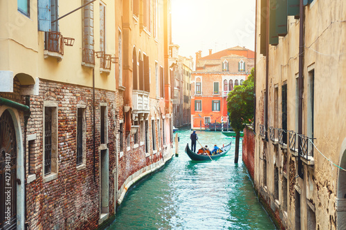 Beautiful canal with old medieval architecture in Venice, Italy. View of Grand Canal and gondola. Famous travel destination
