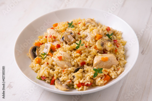 Traditional spanish paella tapa with chicken and vegetables.