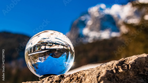 Crystal ball alpine landscape shot at the famous Hintersee with the Reiteralpe in the background at Ramsau, Berchtesgaden, Bavaria, Germany