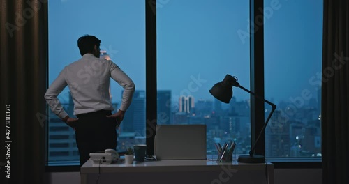 worried asian businessman in office