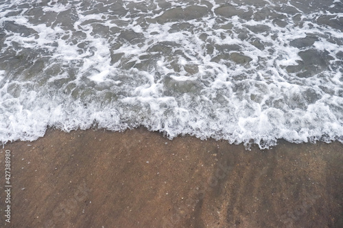 Sea wave in the sandy beach 