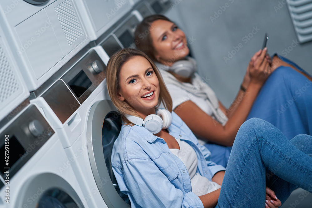 Fototapeta premium Two students in laundry room
