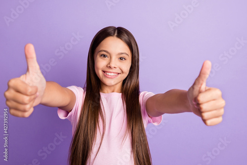 Photo of young schoolgirl happy positive smile show thumb-up ad like cool advise ideal isolated over violet color background