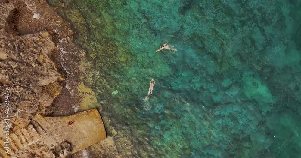 couple people swim in the tropical sea aerial view couple people swim in the tropical sea aerial view