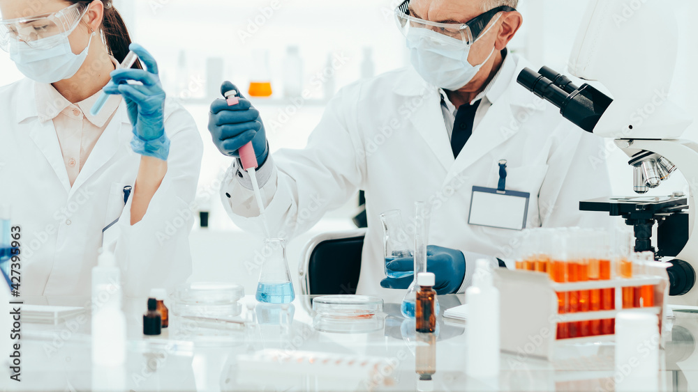 scientists are testing in a medical laboratory. science scientists are testing in a medical laboratory. science
