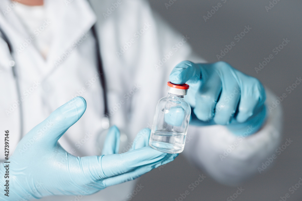 A doctor or scientist in a laboratory develops a medical vaccine. Holds a syringe with liquid vaccines to study and analyze antibody samples for new strain of COVID-19 patients in 2021.
A doctor or scientist in a laboratory develops a medical vaccine. Holds a syringe with liquid vaccines to study and analyze antibody samples for new strain of COVID-19 patients in 2021.