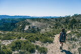 woman hiking on a mountain path in catalonia
