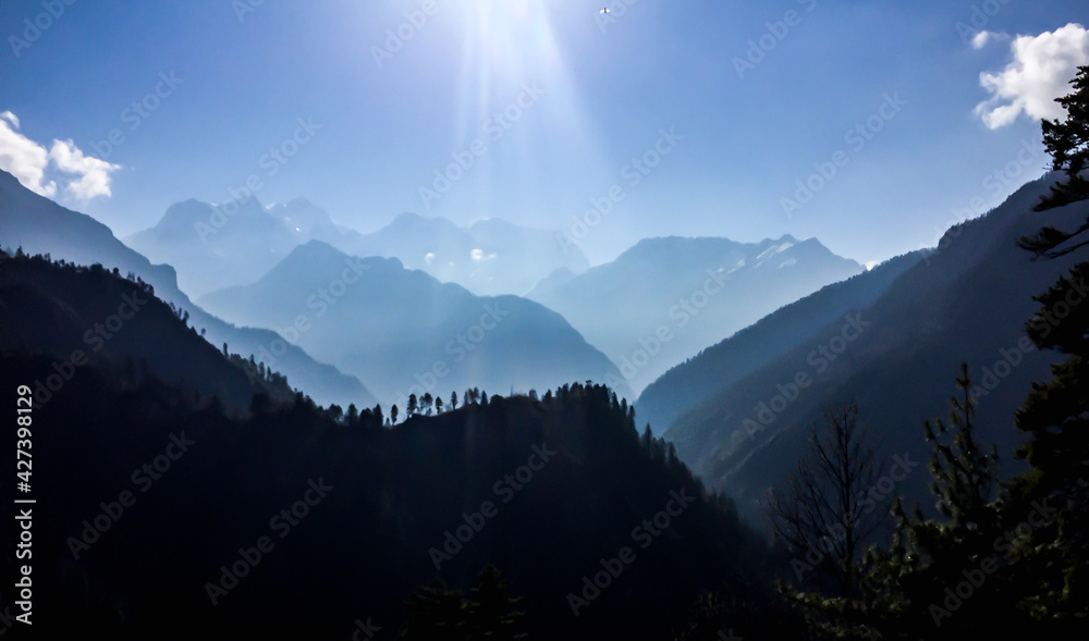 Mountains silhouette on the blue sky background