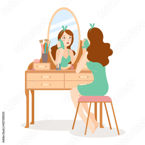 Girl make up and clean her face in front of mirror at dressing table. Skincare and cosmetic daily routine. Isolated vector in flat style.