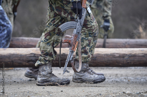 Special forces military training. Photograph detail with military equipment and assault rifle. photo