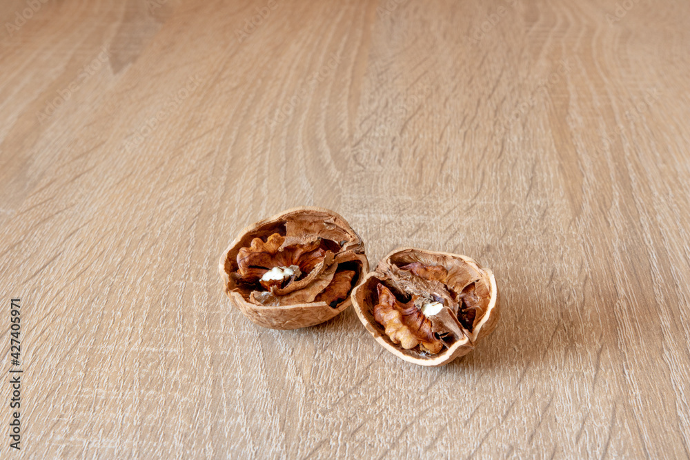 walnuts on a wooden table walnuts on a wooden table