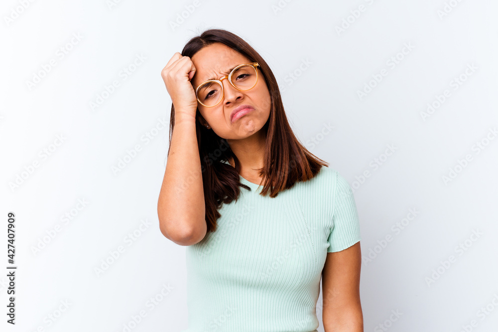 Young mixed race woman isolated tired and very sleepy keeping hand on head. Young mixed race woman isolated tired and very sleepy keeping hand on head.