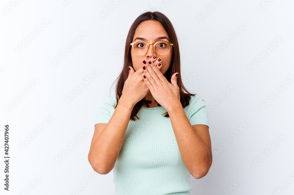 Young mixed race woman isolated covering mouth with hands looking worried. Young mixed race woman isolated covering mouth with hands looking worried.