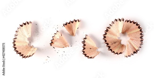 Wooden spiral pencil shavings from sharpener isolated on white background, top view