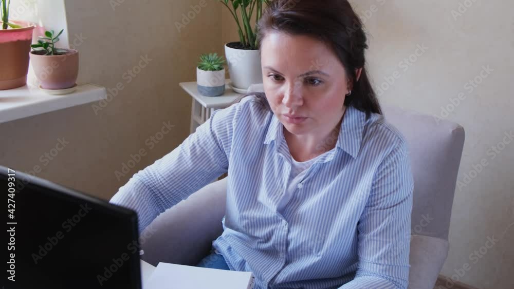 Middle aged woman in casual clothing working from home, remote, home office. Concept for alternative office freelance - 4k footage. Middle aged woman in casual clothing working from home, remote, home office. Concept for alternative office freelance - 4k footage.