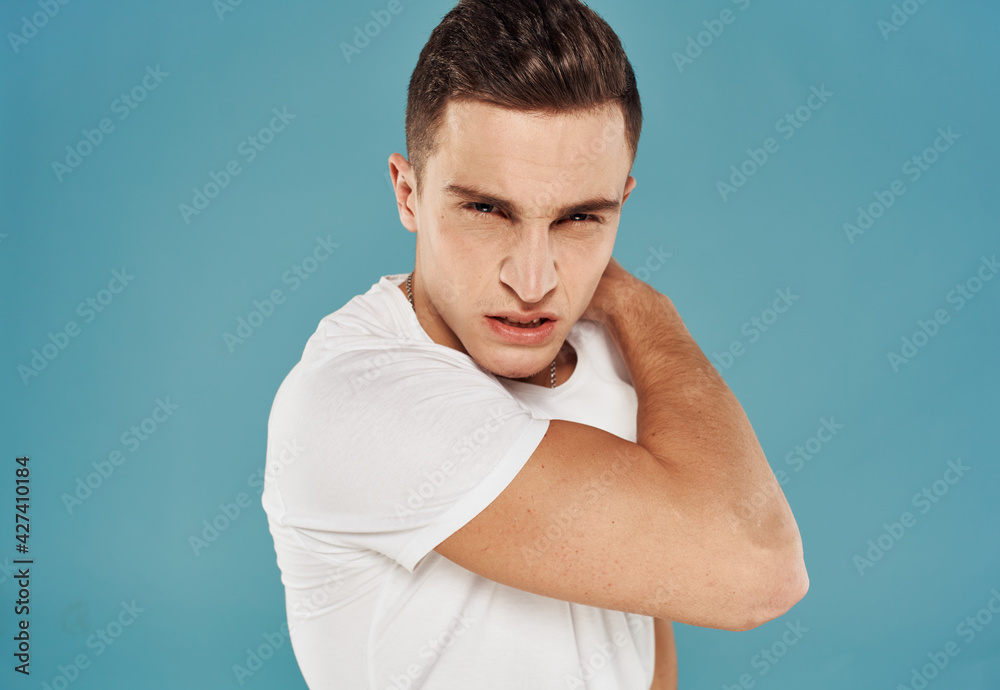 Man in white t-shirt emotions angry look cropped view Studio Man in white t-shirt emotions angry look cropped view Studio