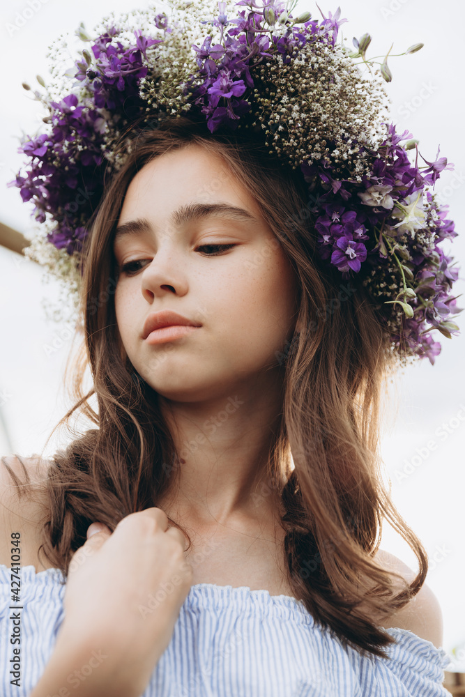 Cute 13-year-old child girl carrying basket of beautiful flower in the flower field with happiness Cute 13-year-old child girl carrying basket of beautiful flower in the flower field with happiness