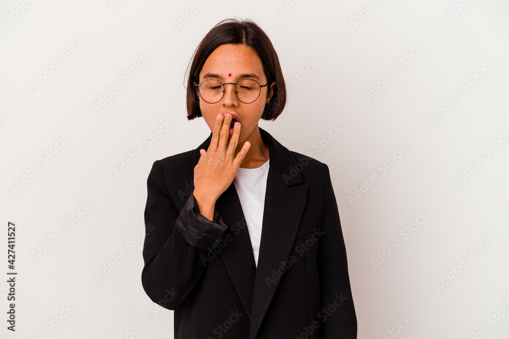 Young business Indian woman isolated on white background yawning showing a tired gesture covering mouth with hand. Young business Indian woman isolated on white background yawning showing a tired gesture covering mouth with hand.