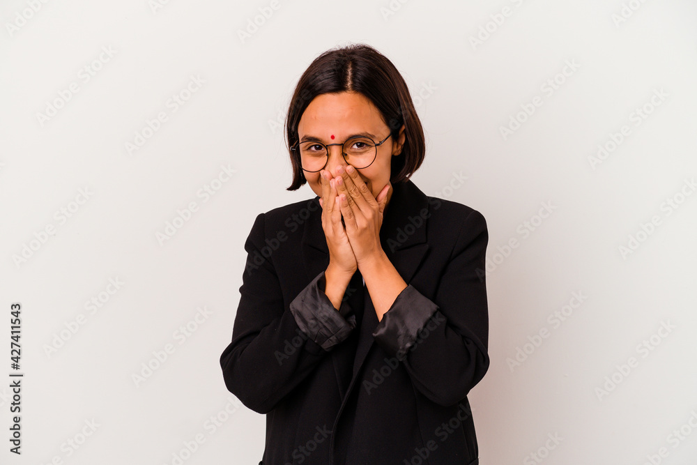 Young business Indian woman isolated on white background laughing about something, covering mouth with hands. Young business Indian woman isolated on white background laughing about something, covering mouth with hands.