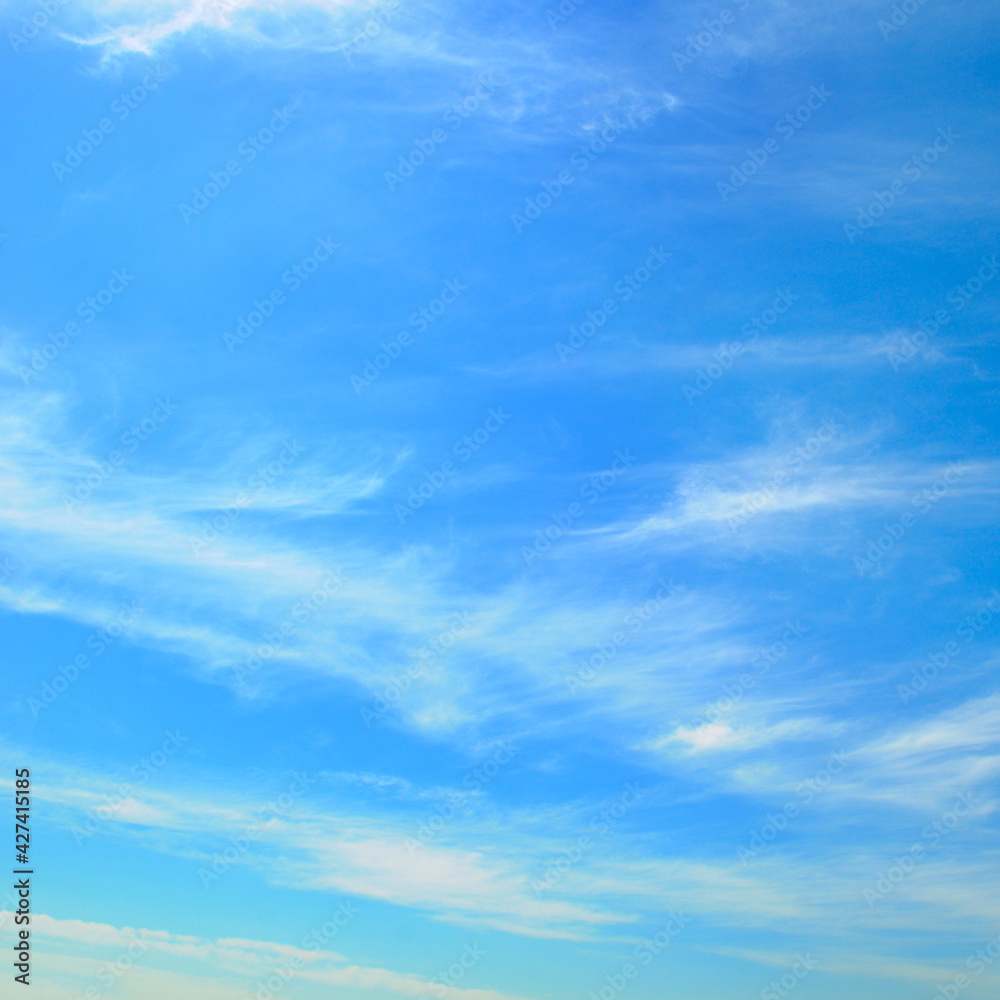 Blue sky with white, soft clouds.