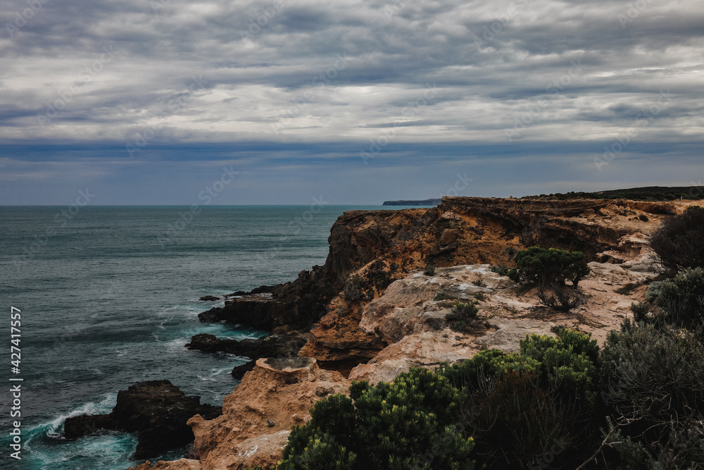 Beautiful ocean view over rocky cliffs on overcast day at Cape Nelson, Portland Victoria Australia