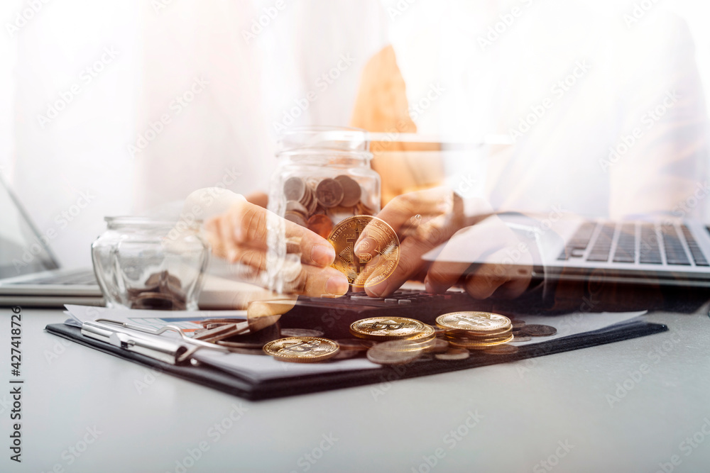 businessman holding coins putting in glass and using calculator. concept saving money and finance accounting. businessman holding coins putting in glass and using calculator. concept saving money and finance accounting.