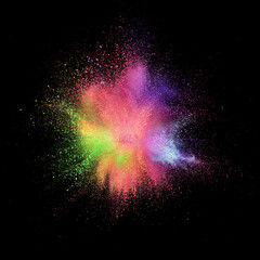 Explosion of colored, fluid and neoned powder on black studio background with copyspace