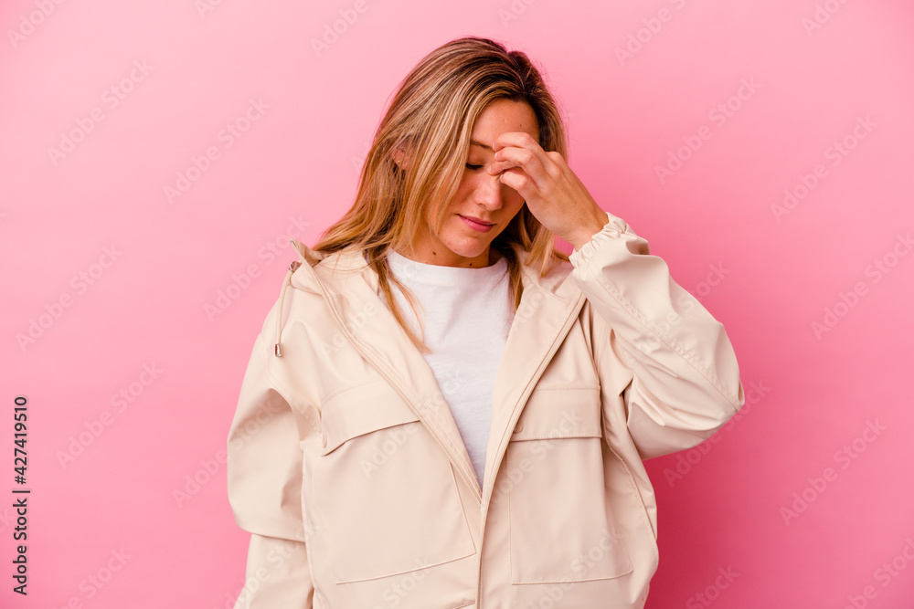 Young mixed race woman isolated on pink background having a head ache, touching front of the face. Young mixed race woman isolated on pink background having a head ache, touching front of the face.