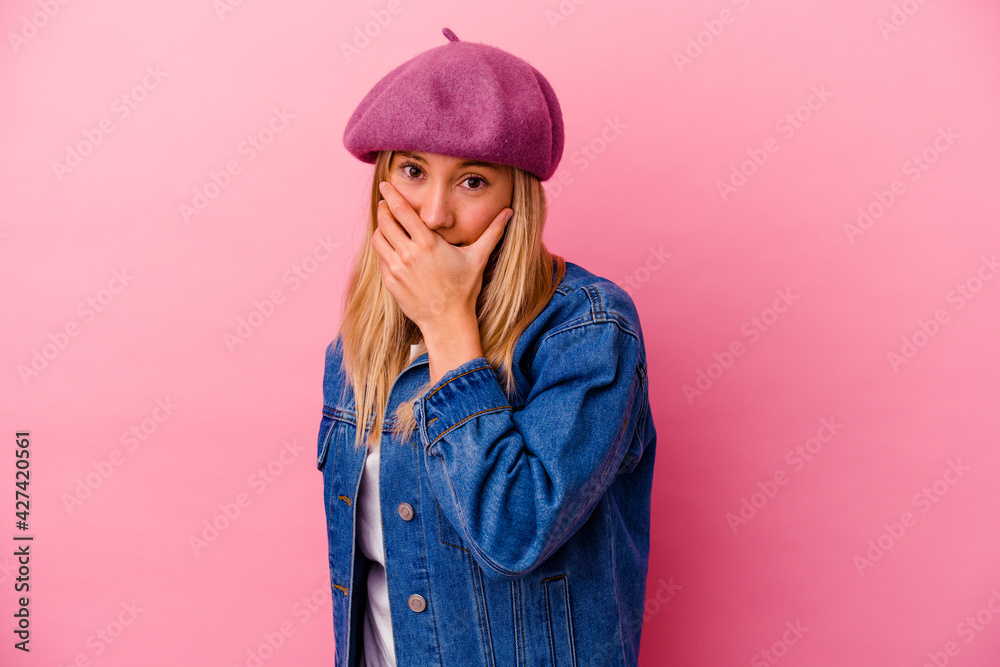 Young mixed race woman isolated on pink background scared and afraid. Young mixed race woman isolated on pink background scared and afraid.