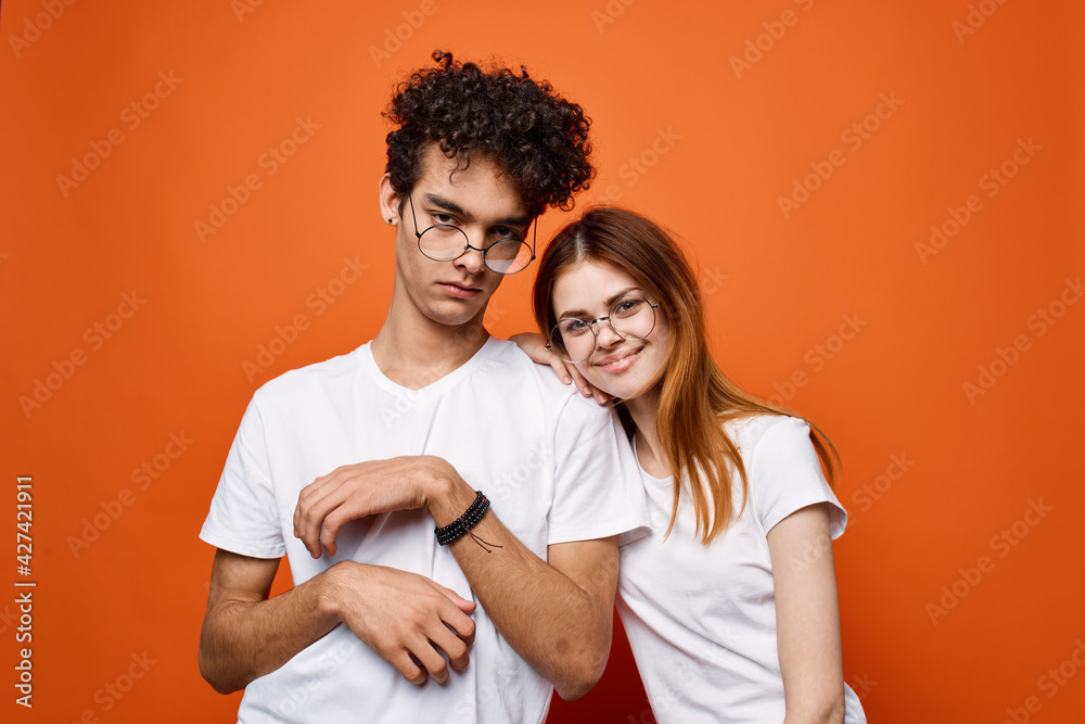 young couple in white t-shirts and glasses fun communication joy young couple in white t-shirts and glasses fun communication joy