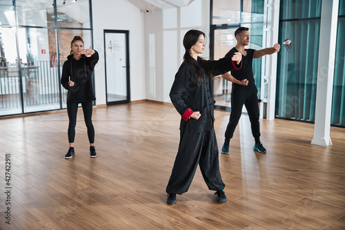 Qigong activity in a room with glass walls