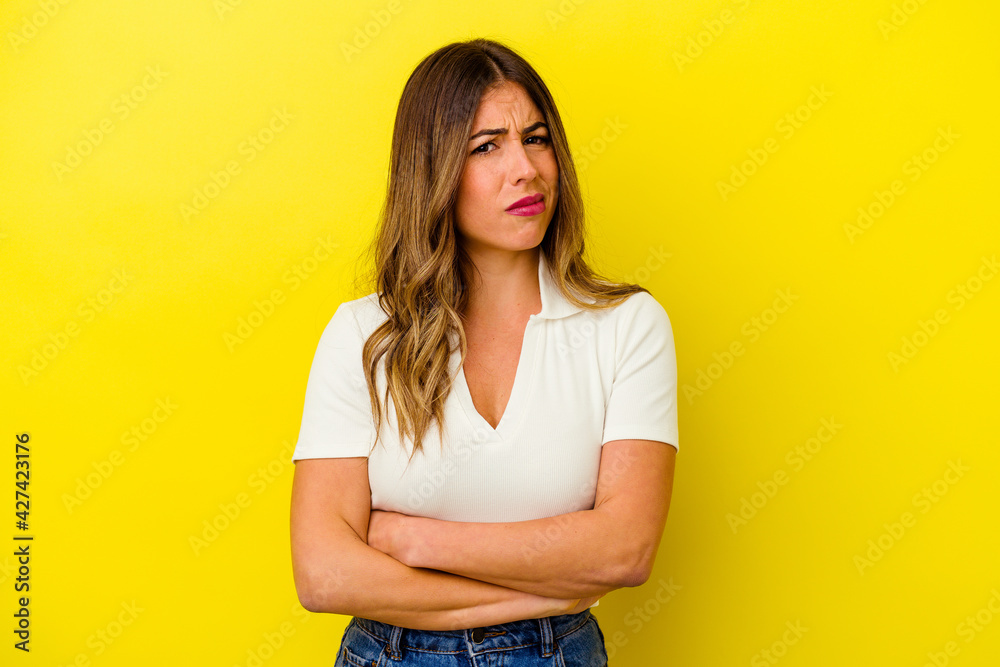 Young caucasian woman isolated on yellow background Young caucasian woman isolated on yellow background