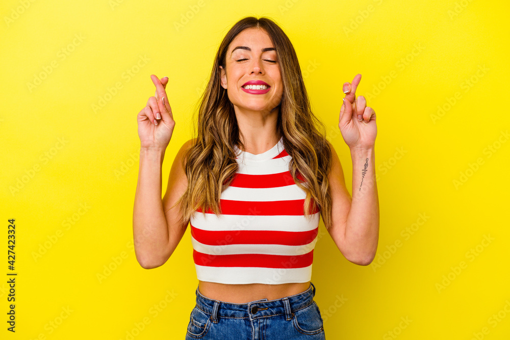Young caucasian woman isolated on yellow background Young caucasian woman isolated on yellow background