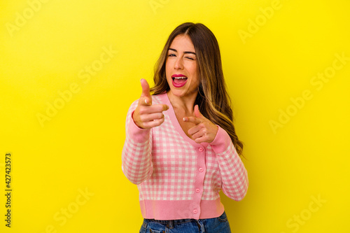 Young caucasian woman isolated on yellow background