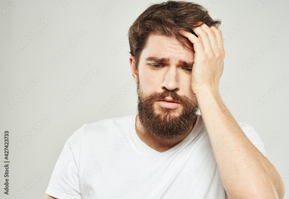 Man in t-shirt cropped view model sad face emotions Man in t-shirt cropped view model sad face emotions