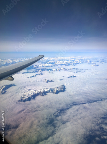 Alps  top through the clouds from a plane