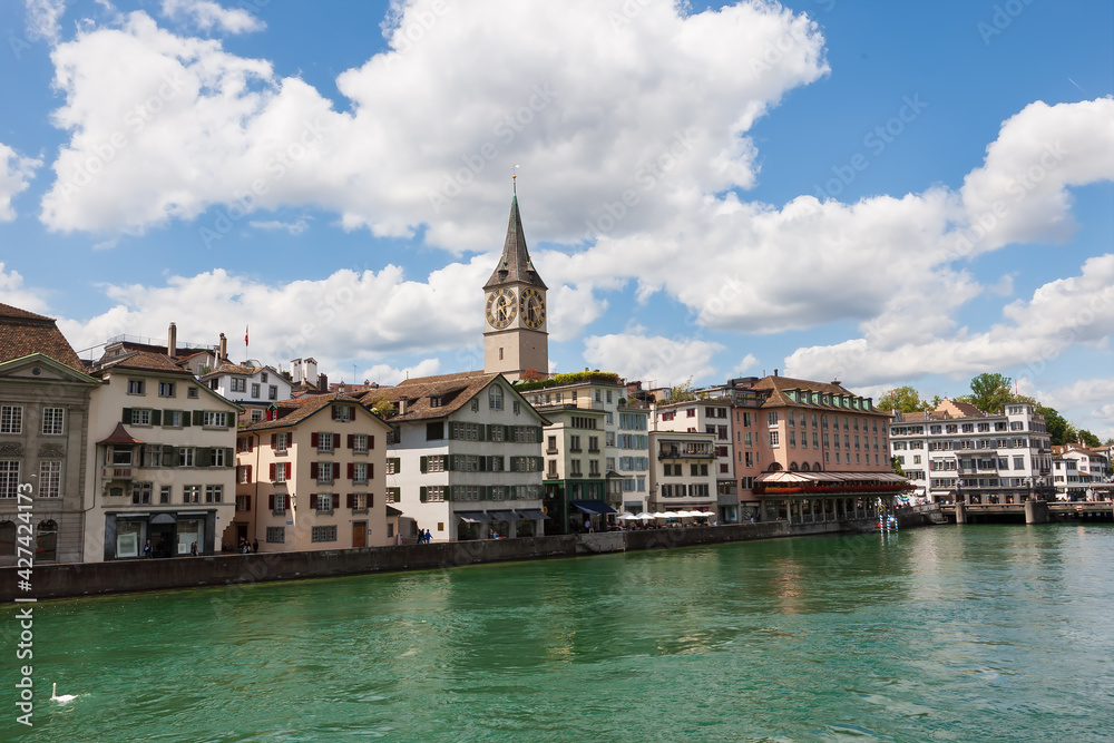 Houses with tiled roofs on the banks of the Limmat River. Zurich, Switzerland