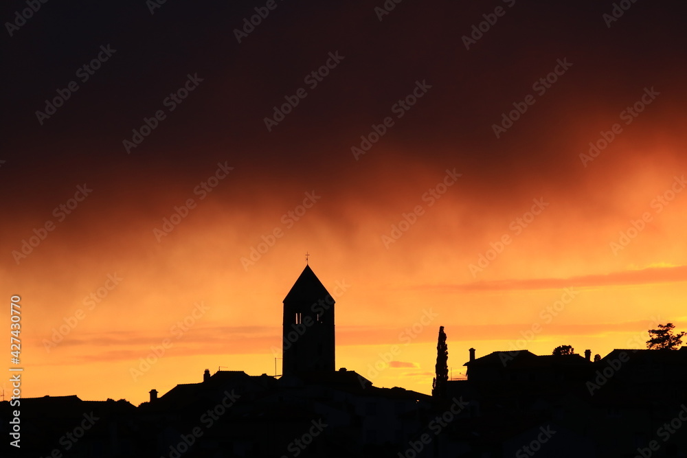 Rab town, bell tower on sunset, Adriatic sea, Croatia