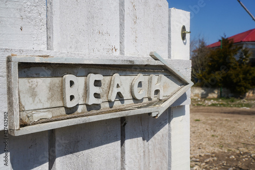 The gate of a boarding house in Vama Veche that indicates the direction to the beach.