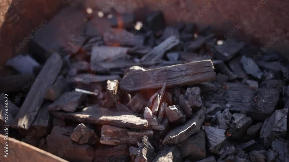 Coals burn in the grill. barbecue bonfire. Rest in nature, patio, screensaver background appeasement delighting flame fire fever Coals burn in the grill. barbecue bonfire. Rest in nature, patio, screensaver background appeasement delighting flame fire fever