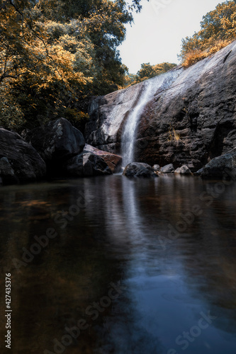 a small water fall with low shutter speed and with authum colours